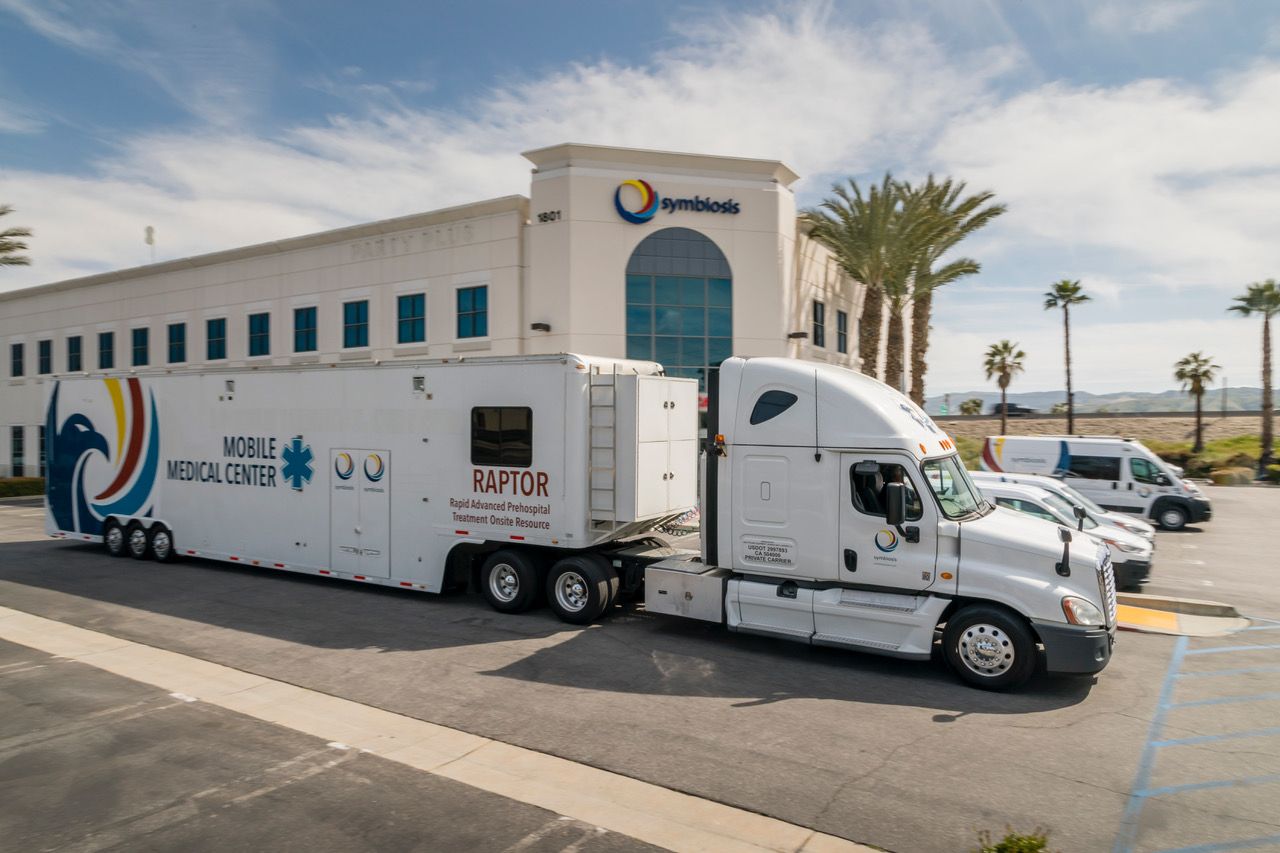 Symbiosis RAPTOR Mobile Medical Center trailer staged outside headquarters